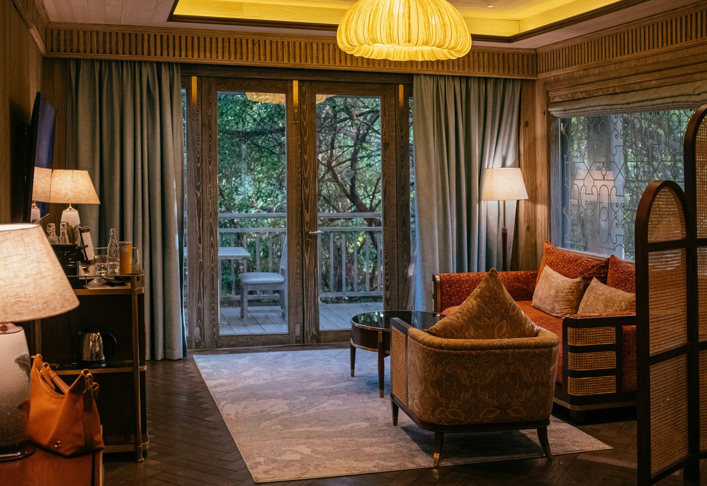 Penthouse Suite with private balcony overlooking treetops