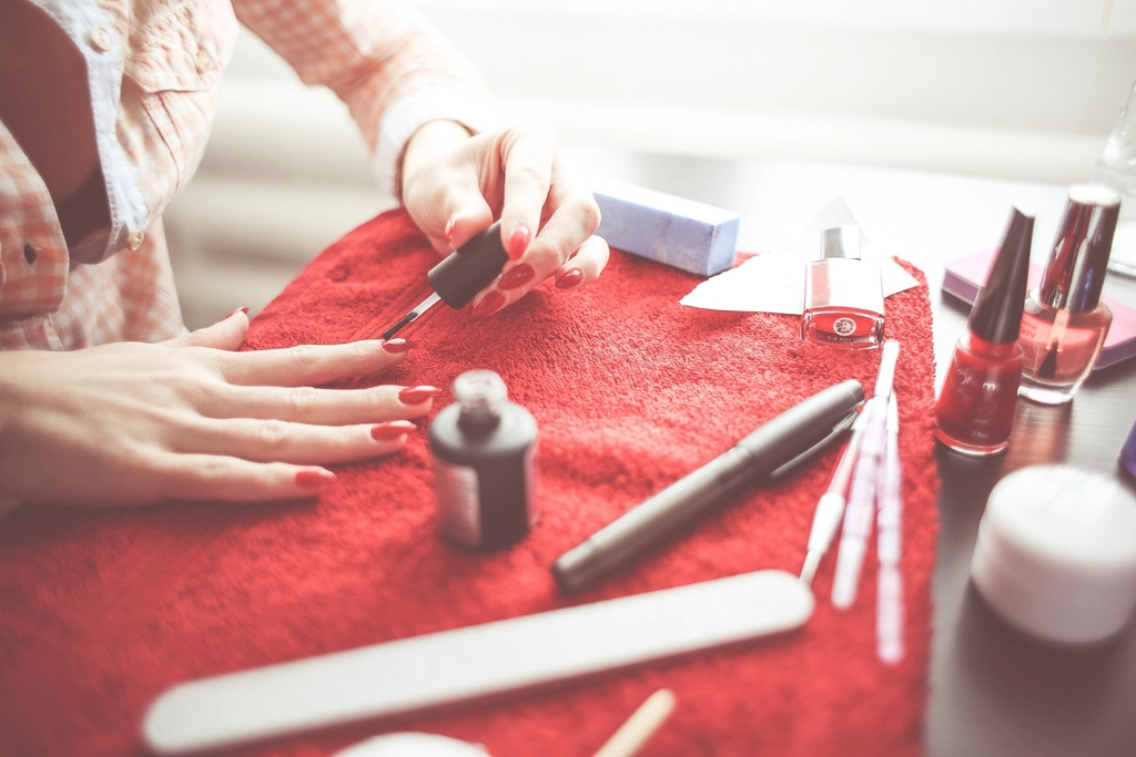 Nail technician applying polish carefully