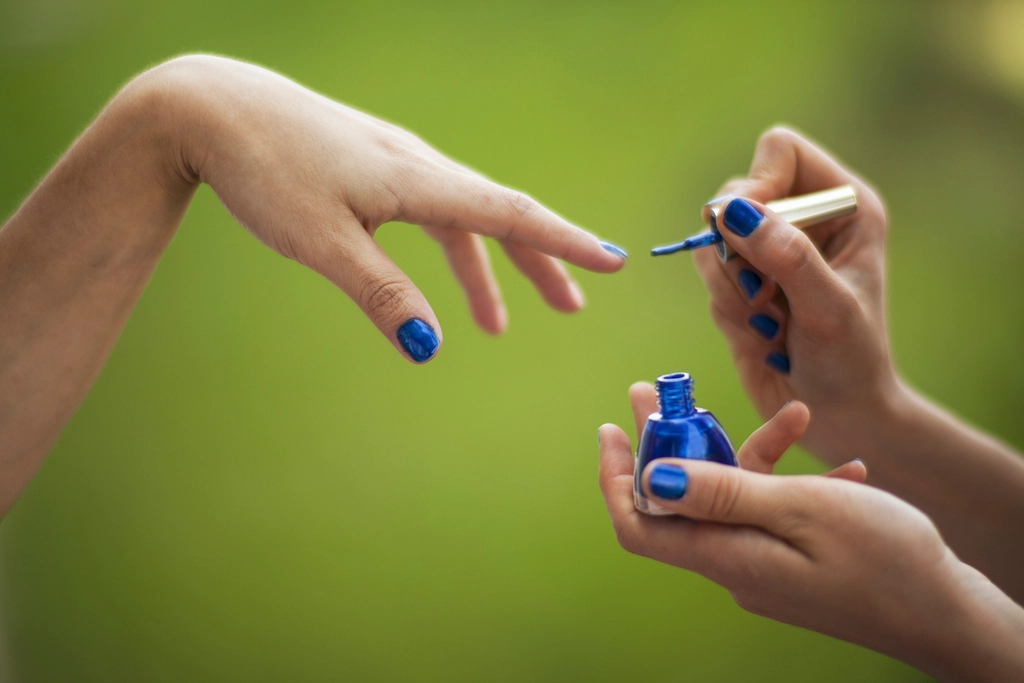 Close-up of polished nails and premium beauty treatment tools