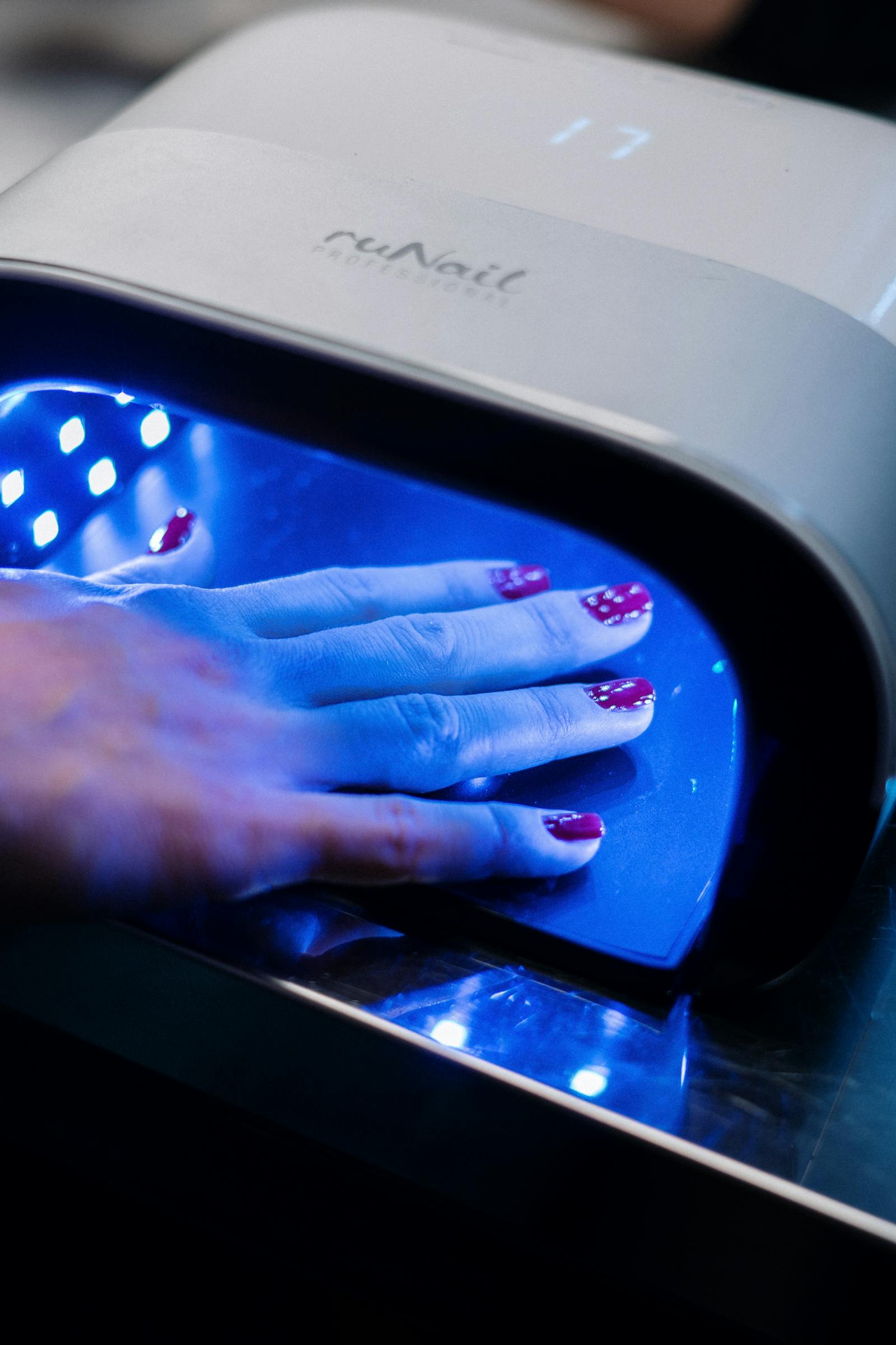 UV nail lamp during a gel manicure session.
